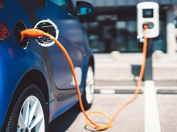 An electric vehicle plugged into a charging port.